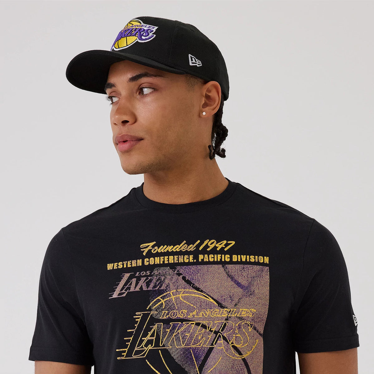 The model is wearing this NBA Graphic LA Lakers T-Shirt in black. 6