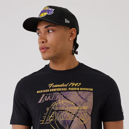 The model is wearing this NBA Graphic LA Lakers T-Shirt in black. 6