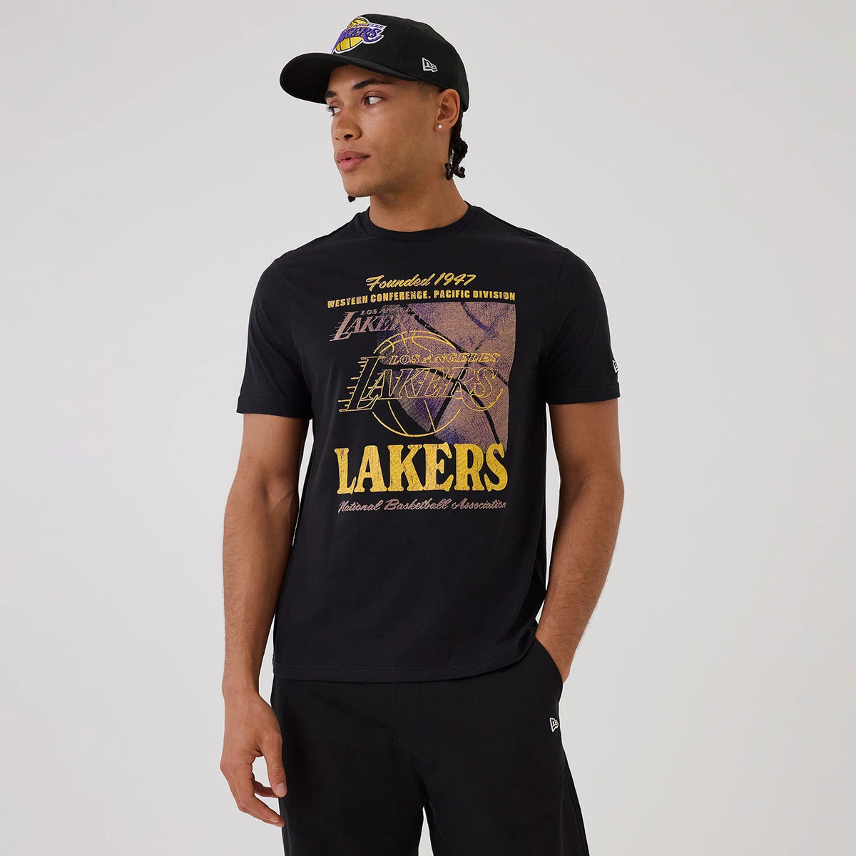 The model is wearing this NBA Graphic LA Lakers T-Shirt in black. 1