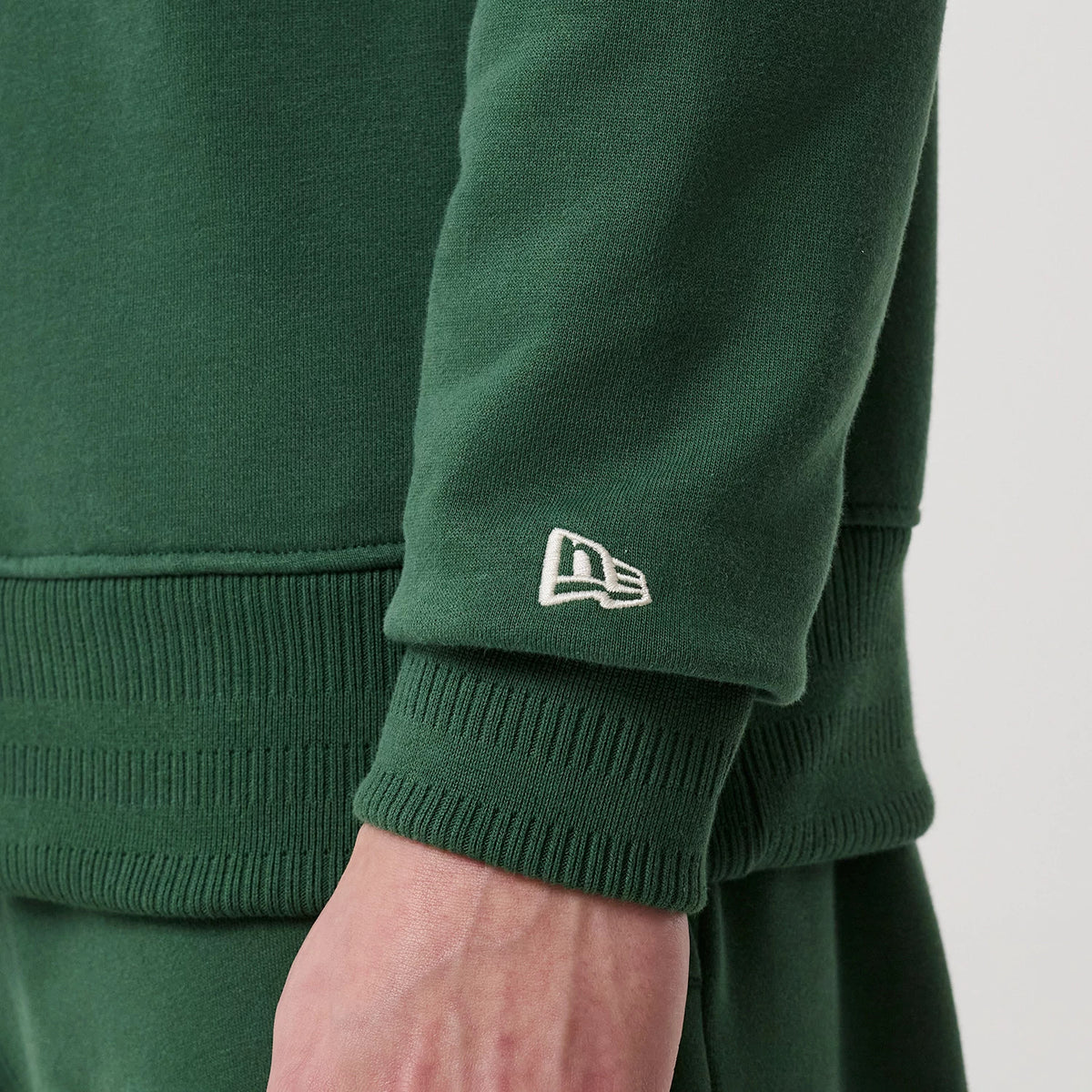The model is wearing this MLB LA Dodgers 1/4 Zip Sweater in dark green. 7
