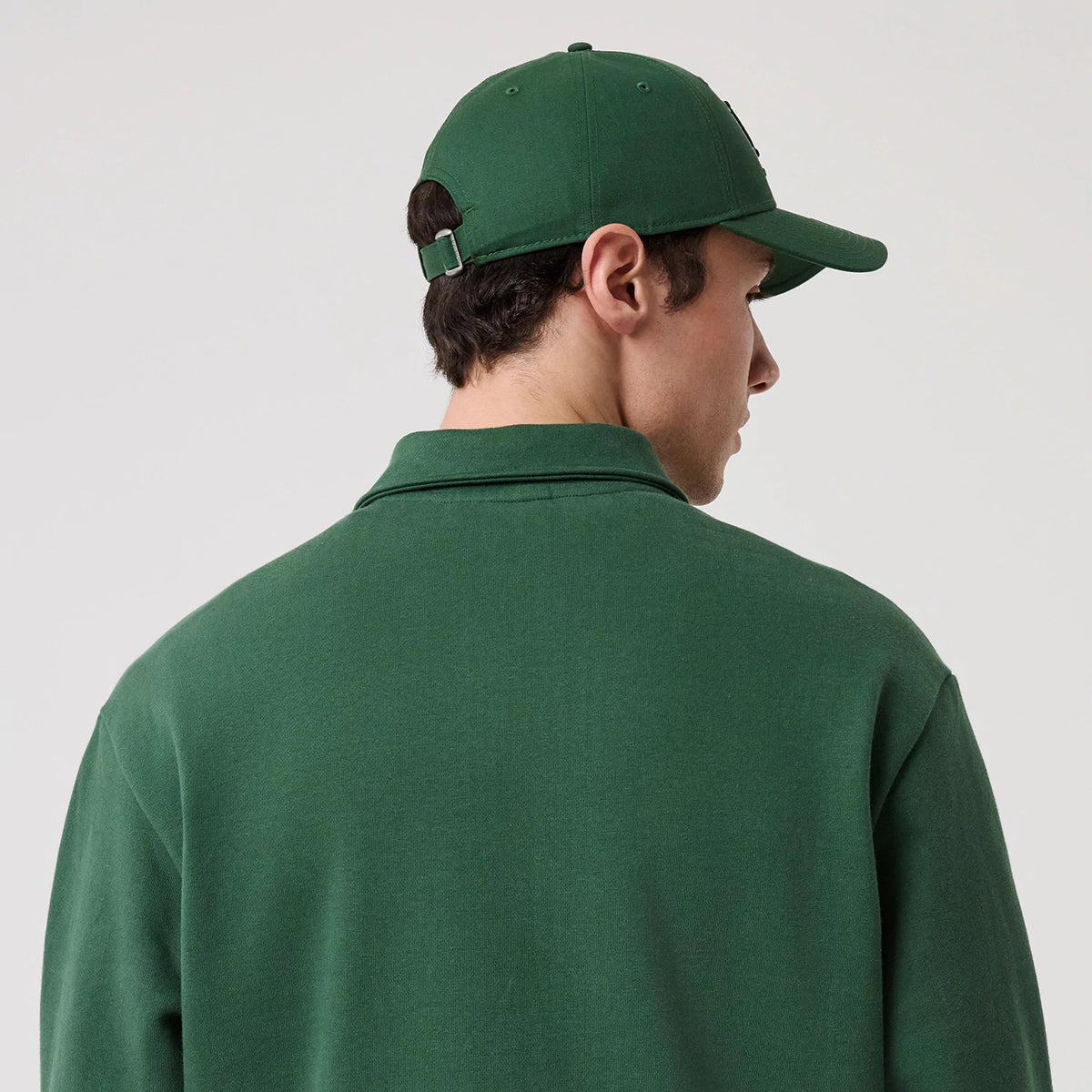 The model is wearing this MLB LA Dodgers 1/4 Zip Sweater in dark green. 8
