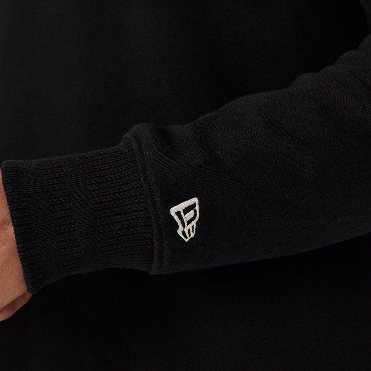 The model is wearing this MLB New York Yankees 1/4 Zip Sweater in black. 7