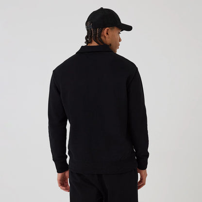 The model is wearing this MLB New York Yankees 1/4 Zip Sweater in black. 2