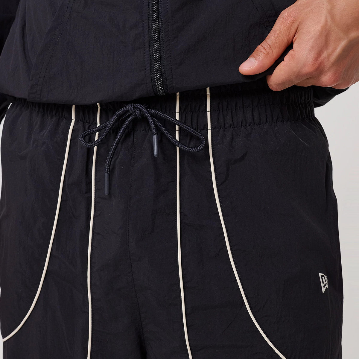 The model is wearing this MLB Piping New York Yankees Track Pants in navy. 5