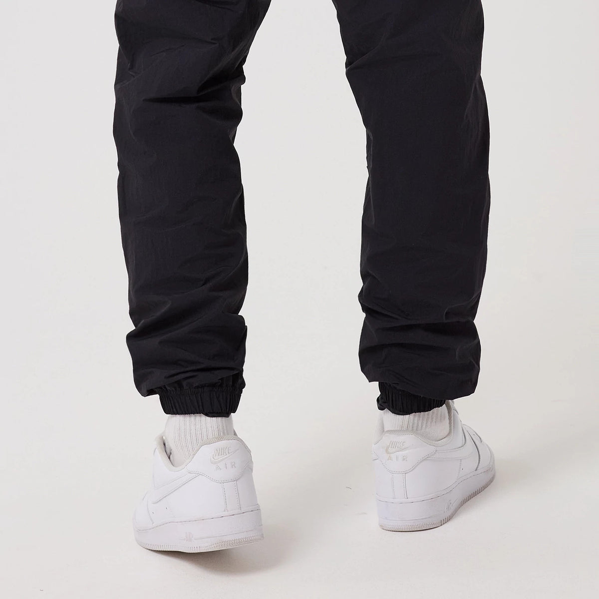 The model is wearing this MLB Piping New York Yankees Track Pants in navy. 7