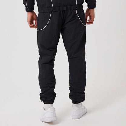 The model is wearing this MLB Piping New York Yankees Track Pants in navy. 2