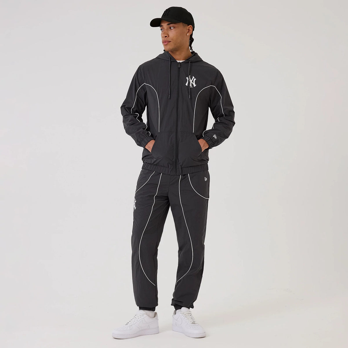 The model is wearing this MLB Piping New York Yankees Track Pants in navy. 8