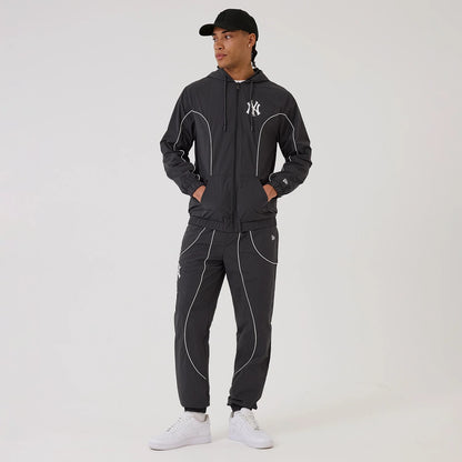 The model is wearing this MLB Piping New York Yankees Track Pants in navy. 8