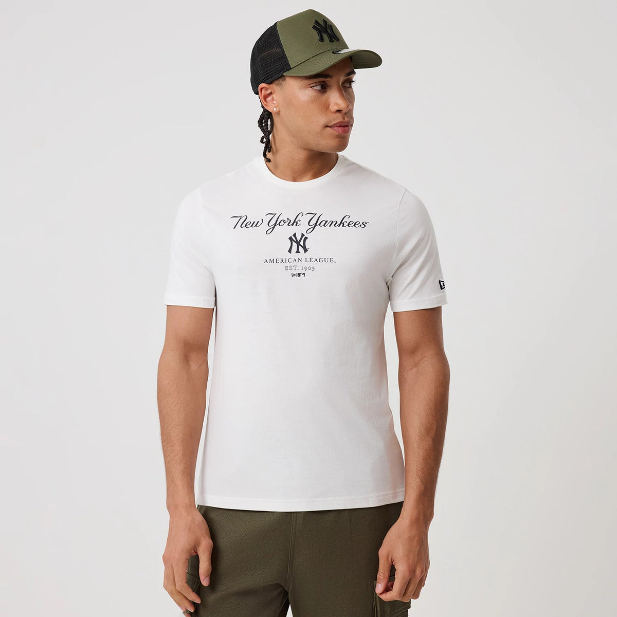 The model is wearing this MLB Linear New York Yankees T-Shirt in white. 3