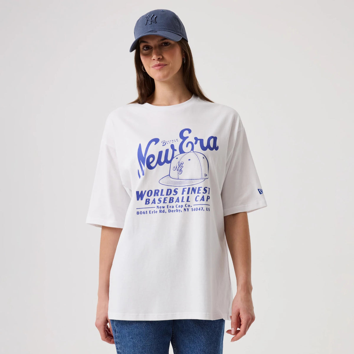 The model is wearing this New Era Heritage Oversized T-Shirt in white. 4