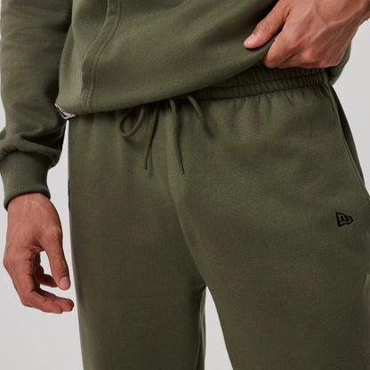 The model is wearing this MLB League Essential New York Yankees Joggers in green. 4