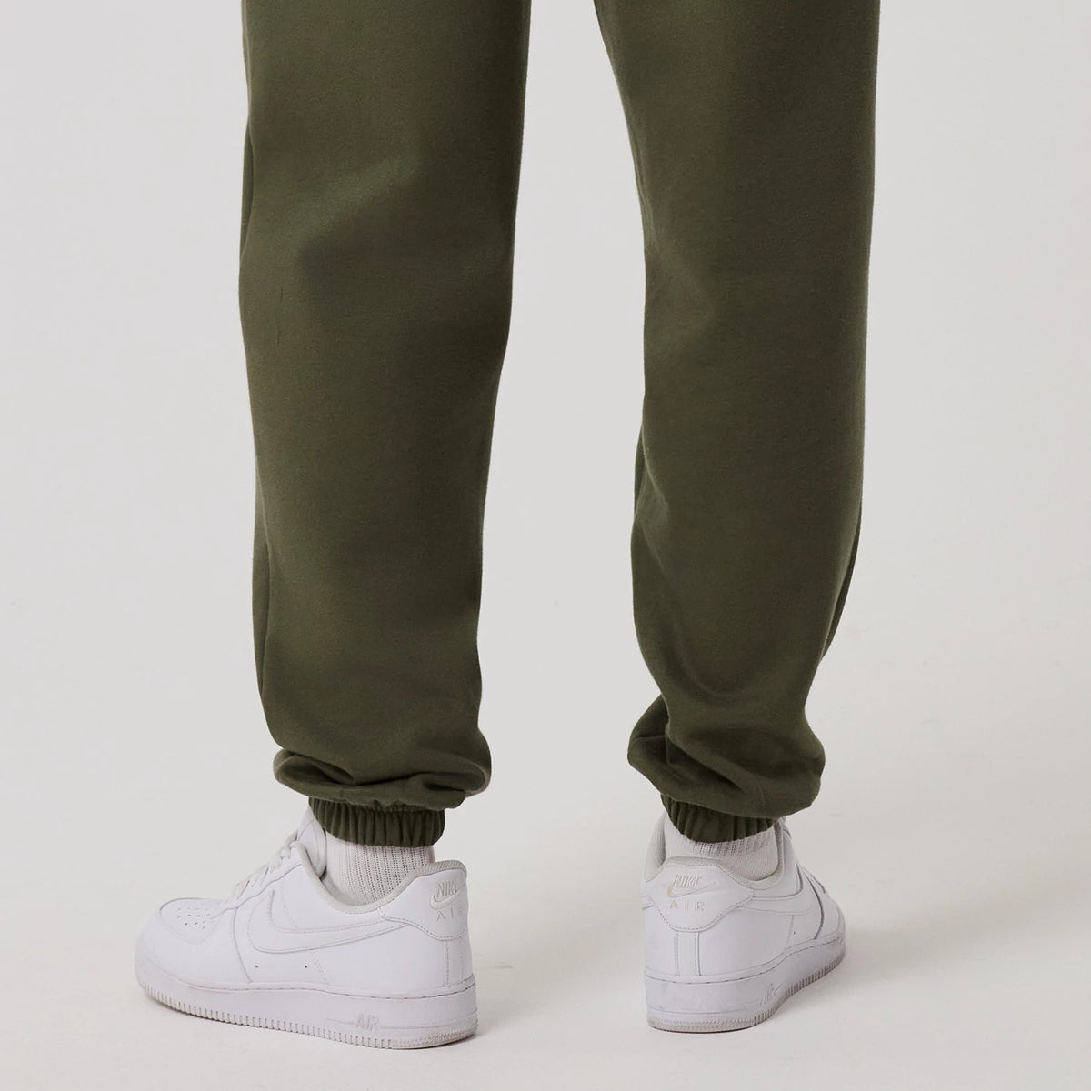 The model is wearing this MLB League Essential New York Yankees Joggers in green. 7
