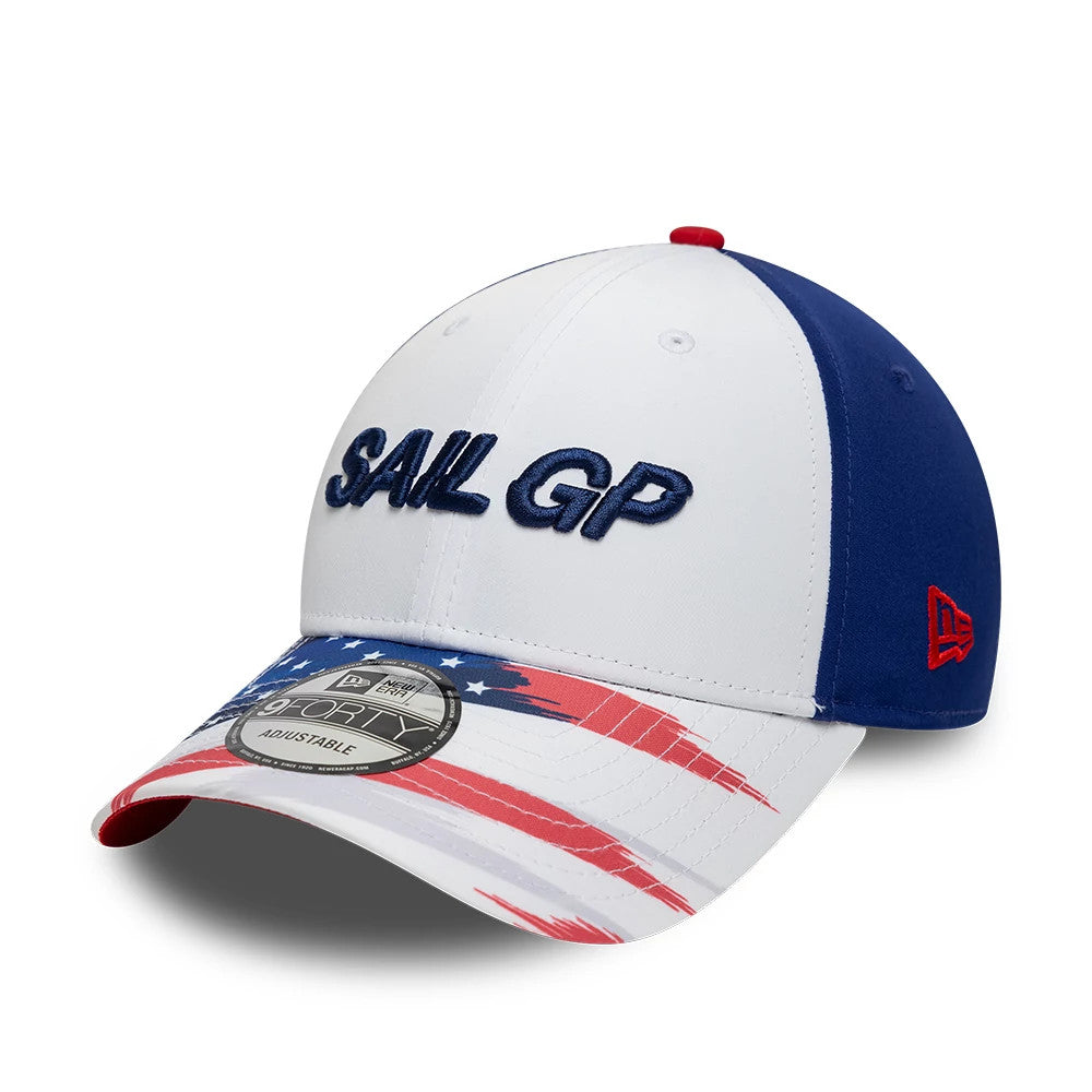 Sail GP USA Air Event White New Era 9FORTY Adjustable Cap, three-quarter view showing navy embroidered Sail GP lettering on the white front panel, a red, white, and blue visor with flag graphics, and the red New Era flag logo on the left side.