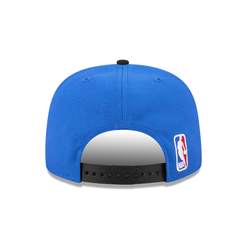 Orlando Magic NBA Tip Off 2026 Blue New Era 9FIFTY A-Frame Snapback Adjustable Cap, rear view showing the NBA logo embroidered on the lower right back panel, a black adjustable strap, and a structured blue crown with a top button.