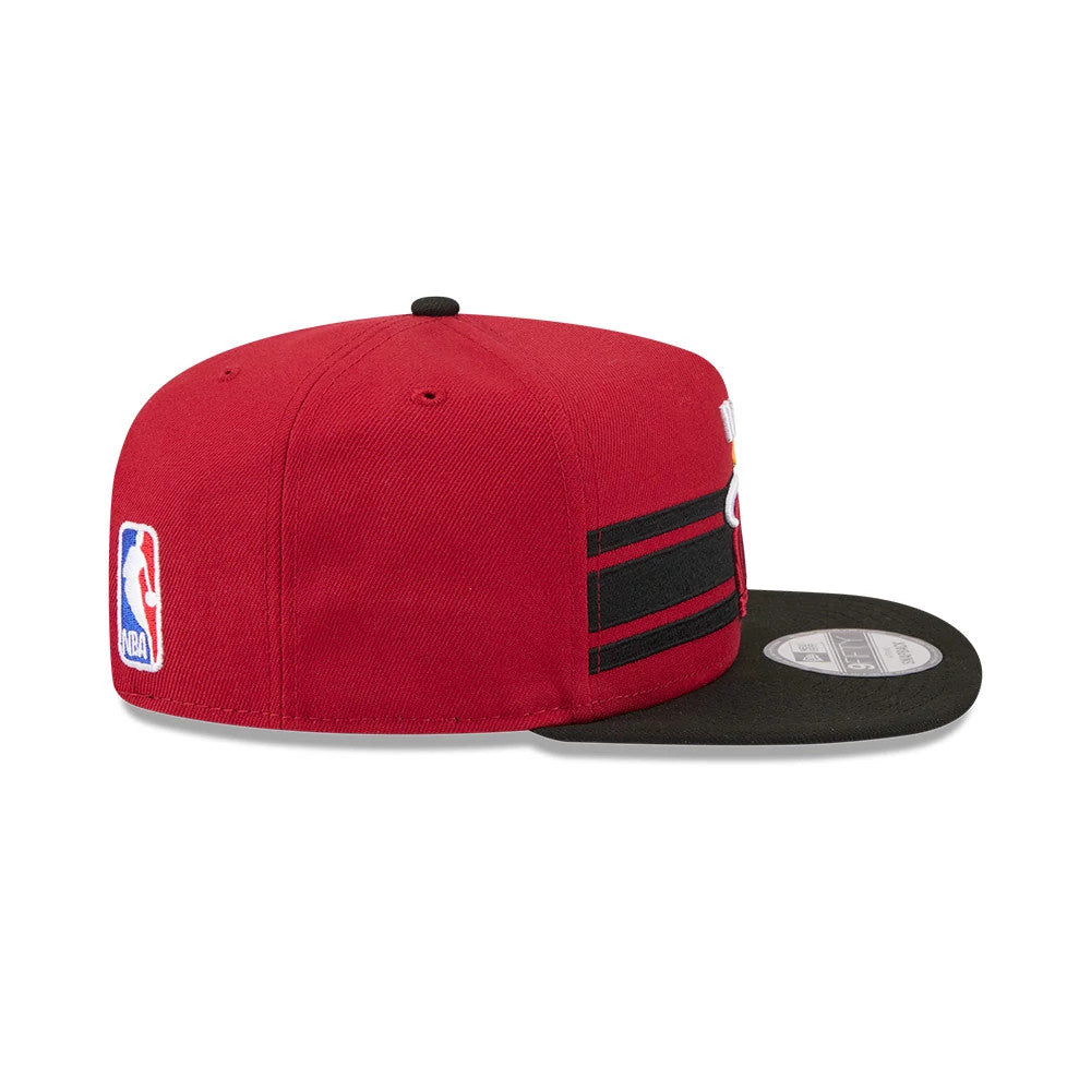 Miami Heat NBA Tip Off 2026 Dark Red New Era 9FIFTY A-Frame Snapback Adjustable Cap, side view with the NBA logo embroidered on the left side, showcasing a structured dark red crown and a flat black visor with a 9FIFTY size sticker.