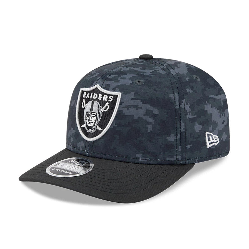 Raiders NFL Digi Camo & Black New Era 9SEVENTY Stretch Snap Adjustable Cap, front view showing a raised embroidered Raiders shield logo in white on the digi camo crown, with a black curved visor and 9SEVENTY size sticker.