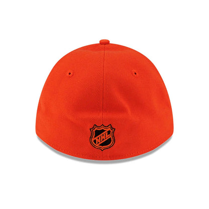 Anaheim Ducks NHL Team Orange New Era 39THIRTY M-Crown Stretch Fit Cap, rear view showing the black embroidered NHL shield logo placed above the curved orange visor, highlighted on the structured bright orange crown with matching eyelets.