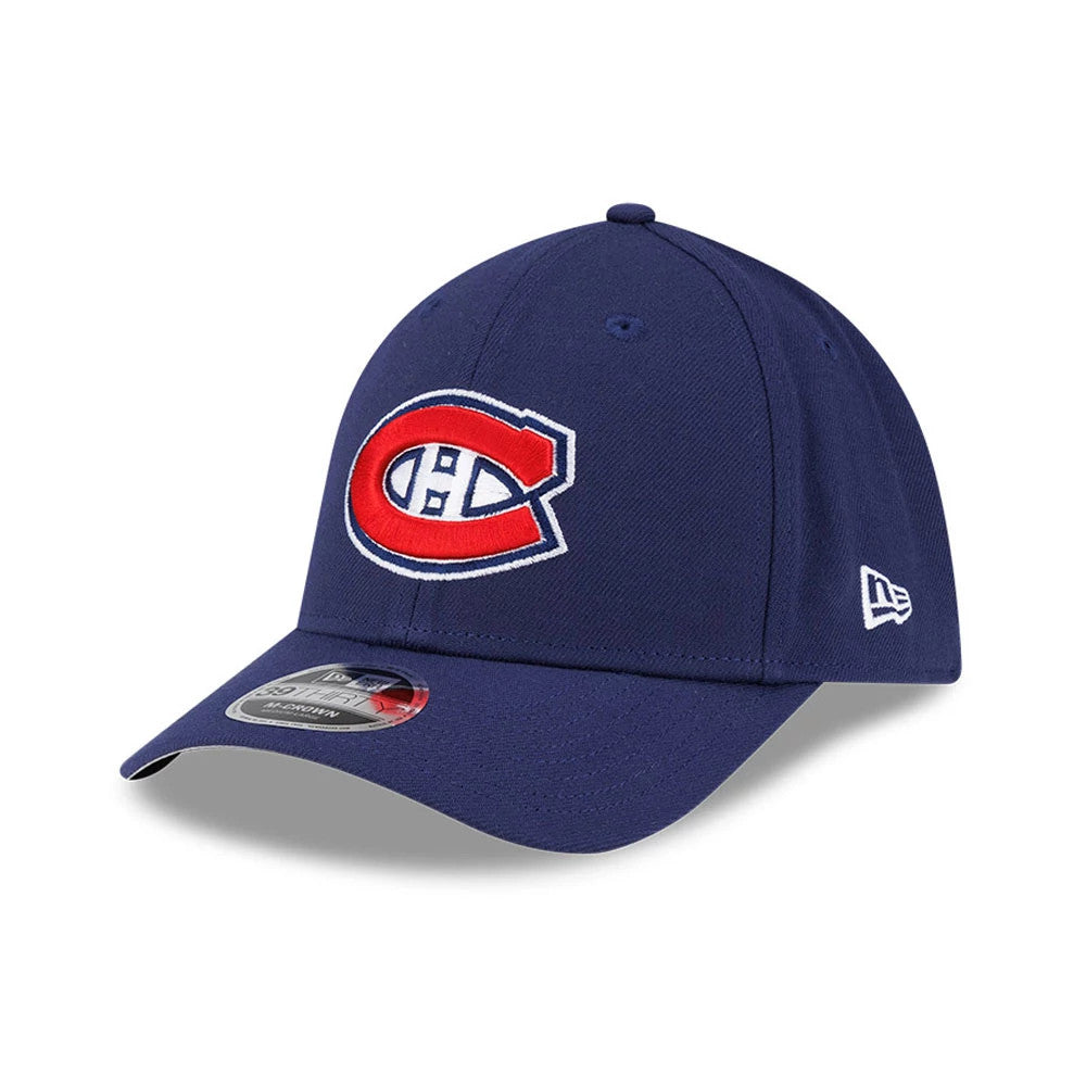 Montreal Canadiens NHL Team Navy New Era 39THIRTY M-Crown Stretch Fit Cap, three-quarter view showing the raised red and white Canadiens logo on the structured navy crown, curved visor with a 39THIRTY size sticker, and New Era flag on the left side.