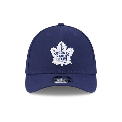 Toronto Maple Leafs NHL Team Navy New Era 39THIRTY M-Crown Stretch Fit Cap, front view showing a white embroidered leaf logo on the navy front panels, navy curved visor with a 39THIRTY size sticker, and matching top button.