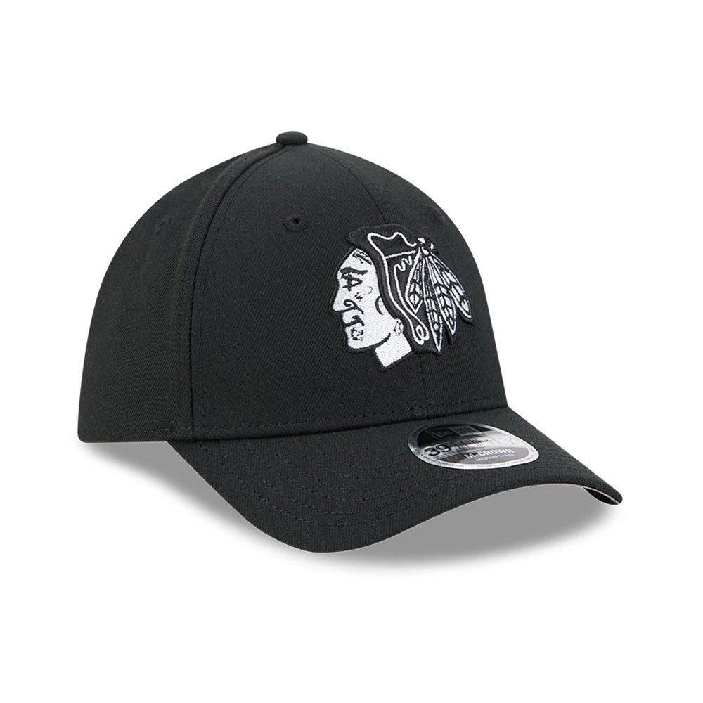 Chicago Blackhawks NHL Black New Era 39THIRTY M-Crown Stretch Fit Cap, three-quarter view showing the white embroidered Blackhawks logo on the front panel, curved black visor with 39THIRTY size sticker, and structured black crown with eyelets.