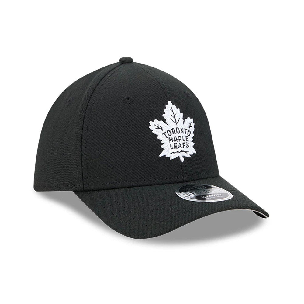 Toronto Maple Leafs NHL Black New Era 39THIRTY M-Crown Stretch Fit Cap, front view showing the raised white embroidered maple leaf logo on the front panel, curved black visor, and 39THIRTY size sticker on the visor.