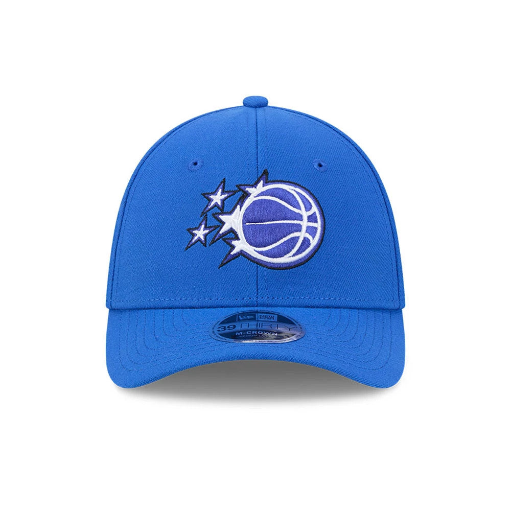 Orlando Magic NBA Team Blue New Era 39THIRTY M-Crown Stretch Fit Cap, front view showing the raised embroidery of the Orlando Magic logo on the structured blue front panel, with a contrasting curved blue visor and 39THIRTY size sticker centred.