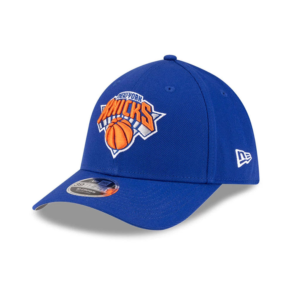 New York Knicks NBA Team Blue New Era 39THIRTY M-Crown Stretch Fit Cap, three-quarter view showing the orange and white embroidered team logo on the front panel, the curved blue visor with a 39THIRTY size sticker.