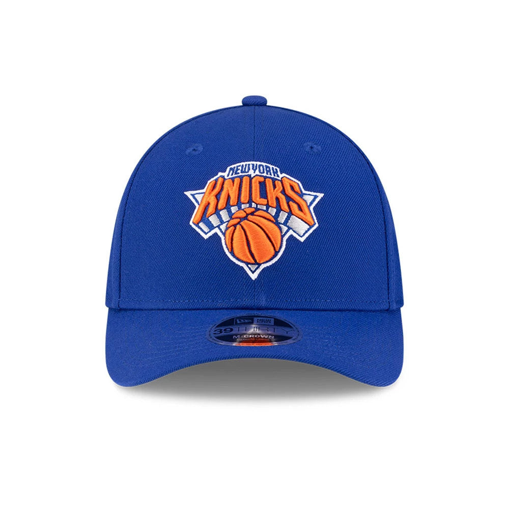 New York Knicks NBA Team Blue New Era 39THIRTY M-Crown Stretch Fit Cap, front view showing a raised orange and white embroidered Knicks logo on the structured blue front panel, with a contrasting blue curved visor and 39THIRTY size sticker.