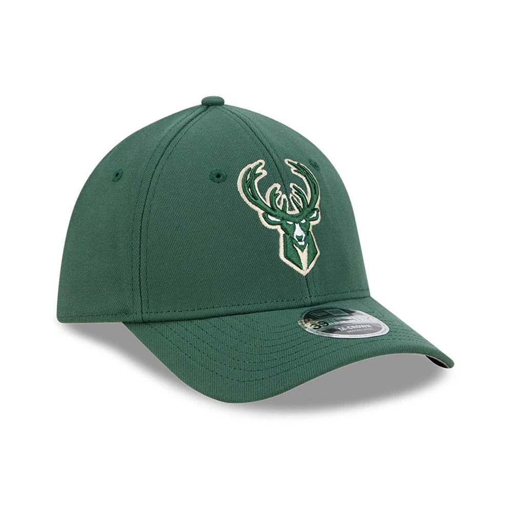 Milwaukee Bucks NBA Team Dark Green New Era 39THIRTY M-Crown Stretch Fit Cap, three-quarter view showing the raised embroidered beige Bucks logo on the front panel, curved dark green visor, and 39THIRTY size sticker on the visor.
