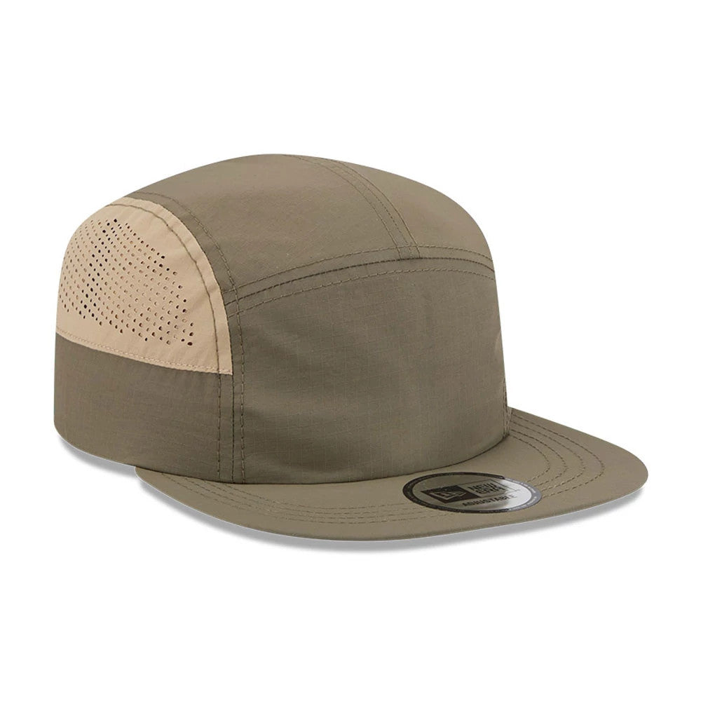 New Era Elevated Basics Open Green Camper Cap, three-quarter view showing the structured green crown with beige side panels featuring perforations, a flat green visor, and the New Era logo on the size sticker.