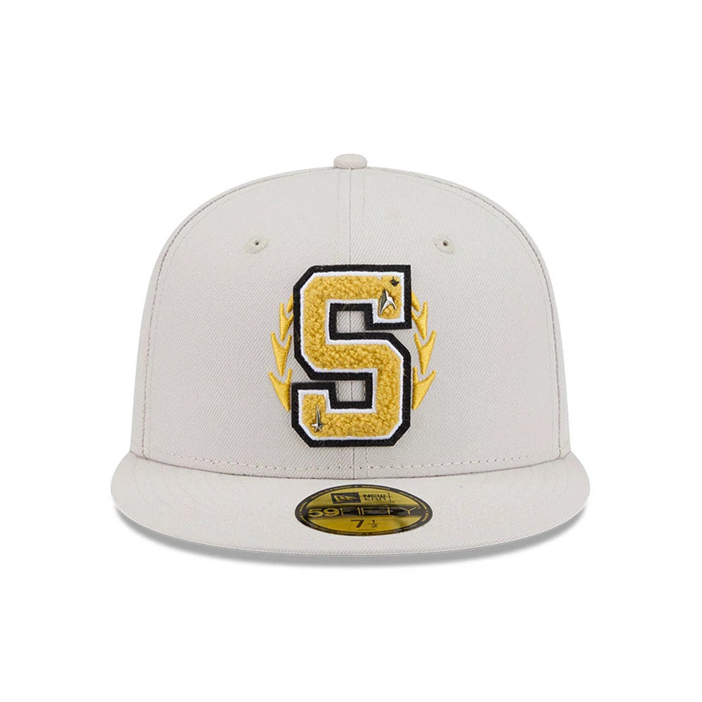 Star Trek Logo Light Beige New Era 59FIFTY Fitted Cap, front view showing a large embroidered yellow letter S with a black outline and star accents, on a light beige crown with a classic flat visor and gold 59FIFTY size sticker.