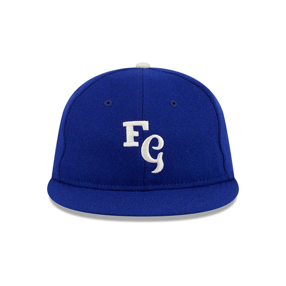 LA Dodgers Fear Of God X MLB Open Blue Retro Crown New Era 59FIFTY Fitted Cap, front view showing the white FG initial logo embroidered on the structured blue crown, with a matching blue visor and a white top button.