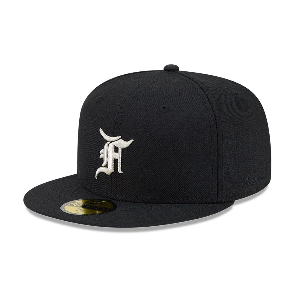 Chicago White Sox Fear Of God X MLB Black New Era 59FIFTY Fitted Cap, three-quarter view showing a white embroidered F logo on the front panel, a flat black visor with a gold 59FIFTY size sticker, and MLB branding on the side.