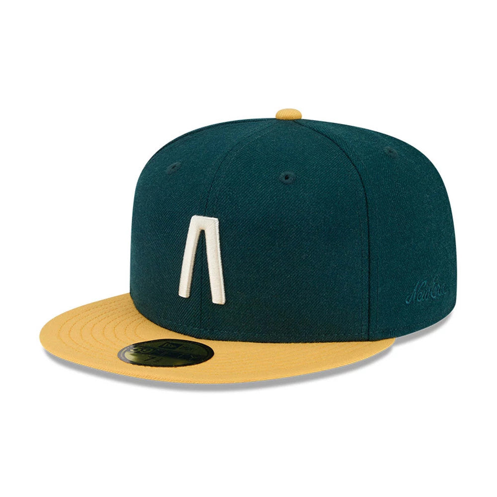 Pictured is this Fear Of God X MLB Logo 59FIFTY Fitted cap in dark green & yellow. 1