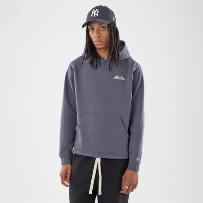 The model is wearing this New Era Open Hem Pullover Hoodie in grey. 1