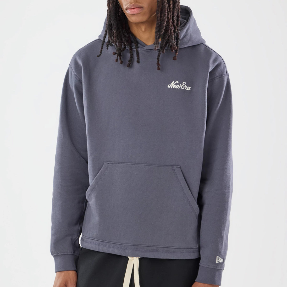 The model is wearing this New Era Open Hem Pullover Hoodie in grey. 3