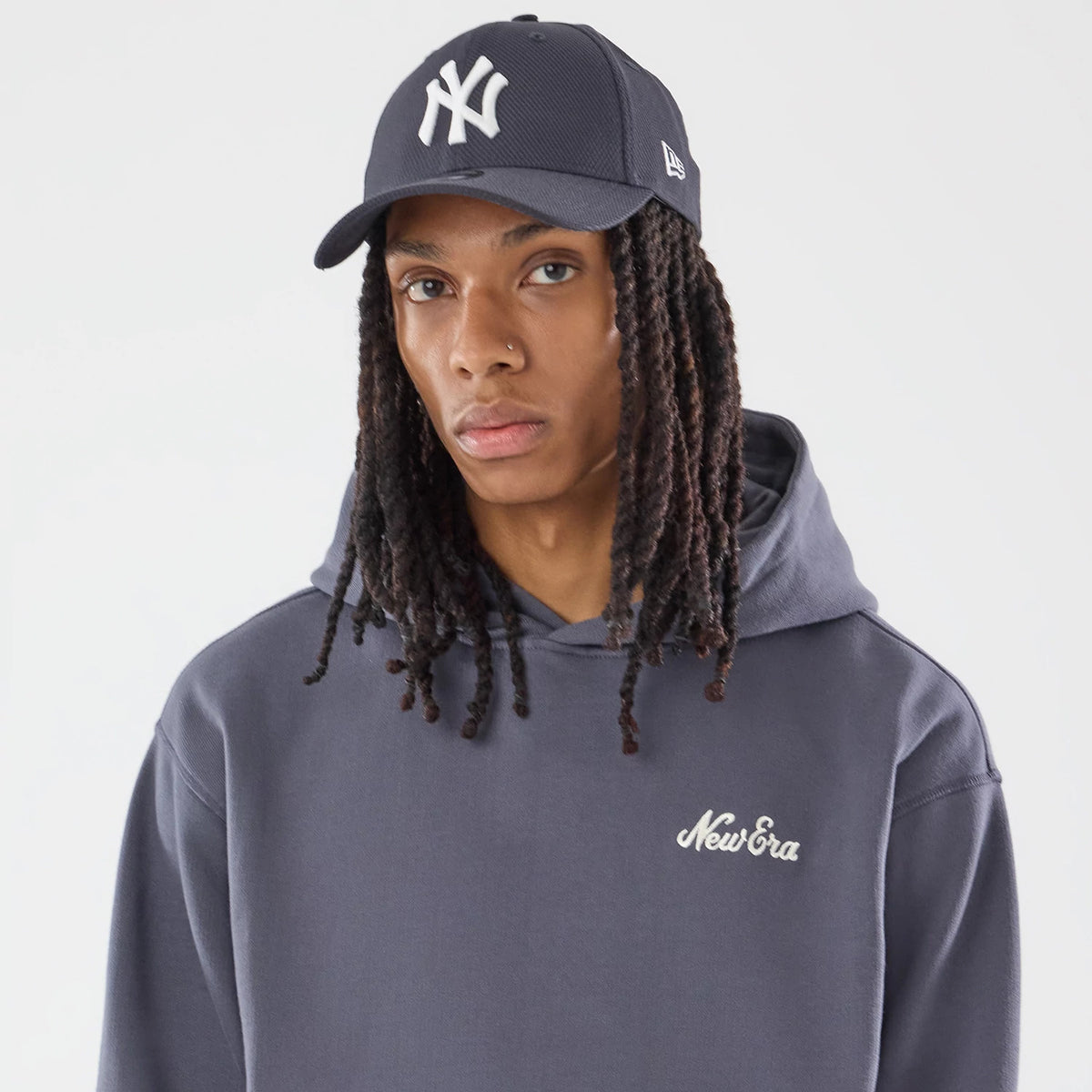 The model is wearing this New Era Open Hem Pullover Hoodie in grey. 6