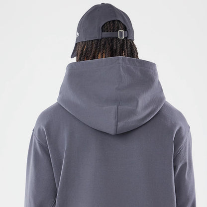 The model is wearing this New Era Open Hem Pullover Hoodie in grey. 7