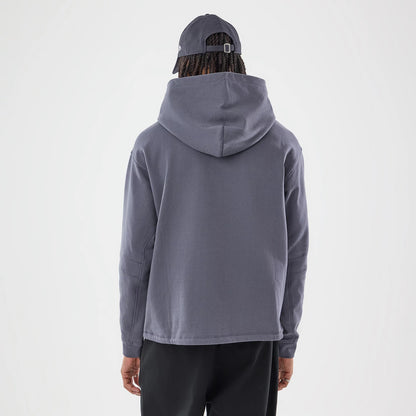 The model is wearing this New Era Open Hem Pullover Hoodie in grey. 2