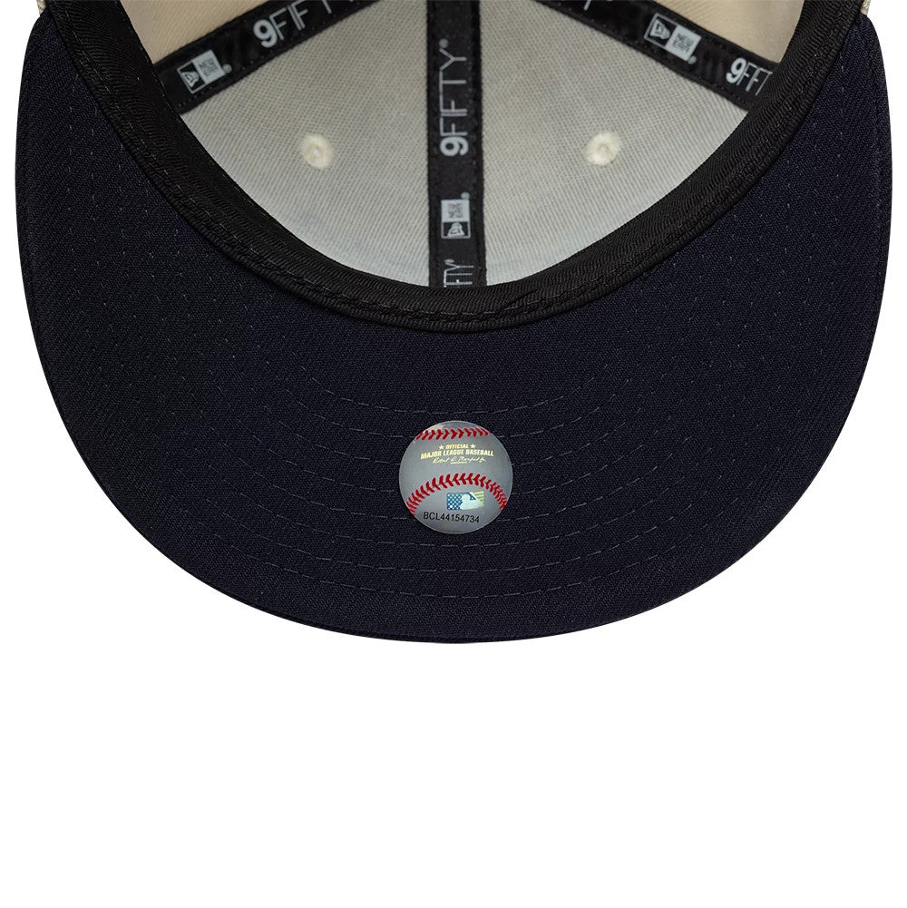 Yankees MLB Ombre Script Light Beige New Era 9FIFTY Snapback Adjustable Cap, inside view showing the grey fabric taping with 9FIFTY branding, a white sweatband, and a black undervisor featuring a baseball-themed authenticity sticker centrally placed.
