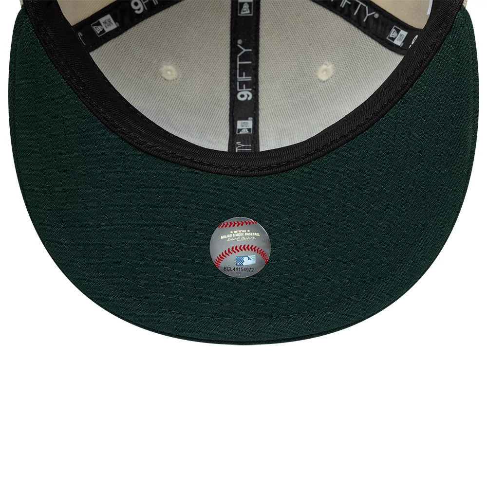 Athletics MLB Ombre Script Beige & Green New Era 9FIFTY Snapback Adjustable Cap, inside view showing the green undervisor, black taping with white 9FIFTY logo, and Major League Baseball holographic sticker at the centre.