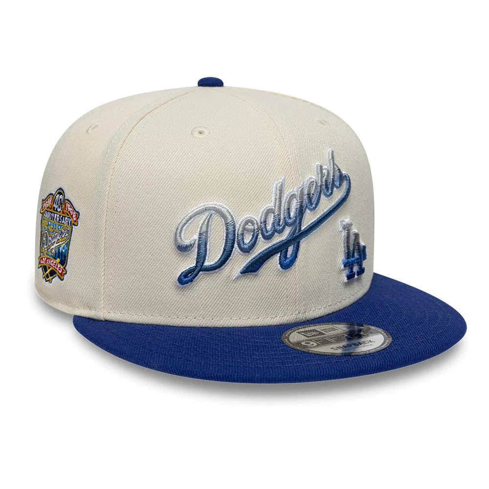 Pictured is this MLB Ombre Script Los Angeles Dodgers 9FIFTY Snapback cap in light beige & blue. 1