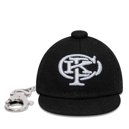 The model is wearing this Gettomasa X New Era Key Chain in black. 3