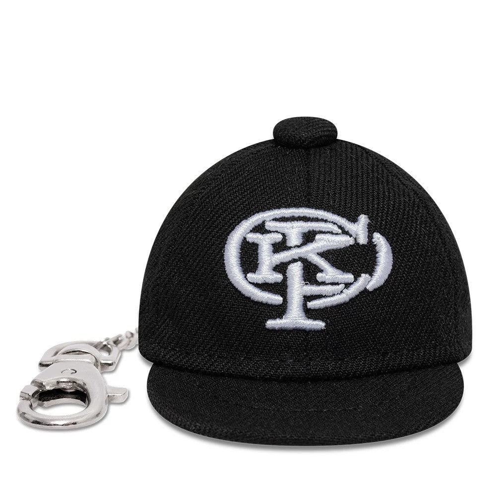 The model is wearing this Gettomasa X New Era Key Chain in black. 3