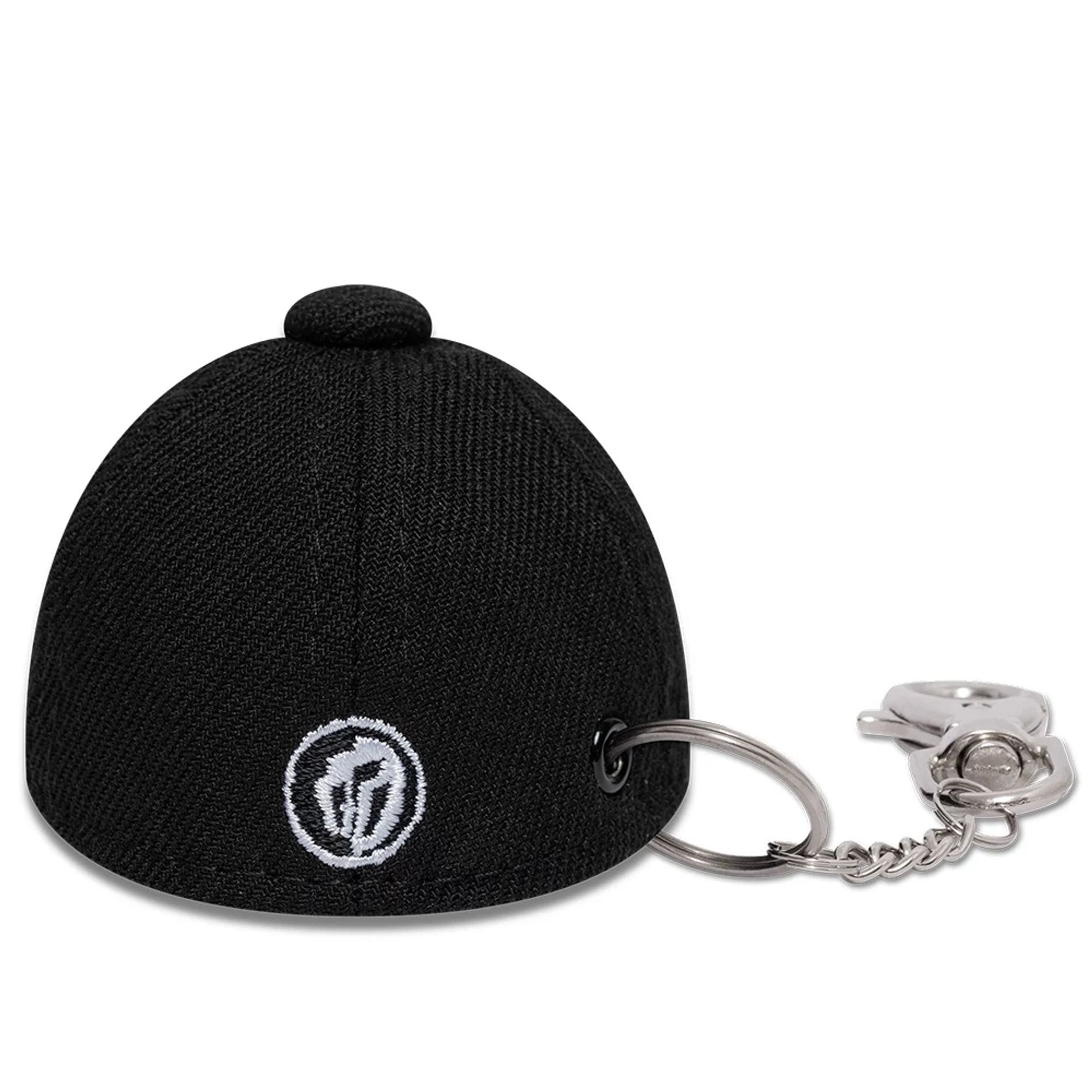 The model is wearing this Gettomasa X New Era Key Chain in black. 5