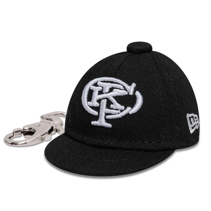 The model is wearing this Gettomasa X New Era Key Chain in black. 1