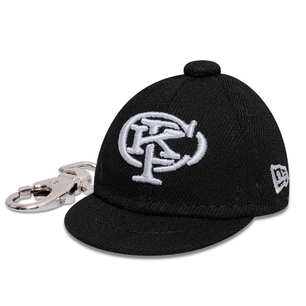 The model is wearing this Gettomasa X New Era Key Chain in black. 1