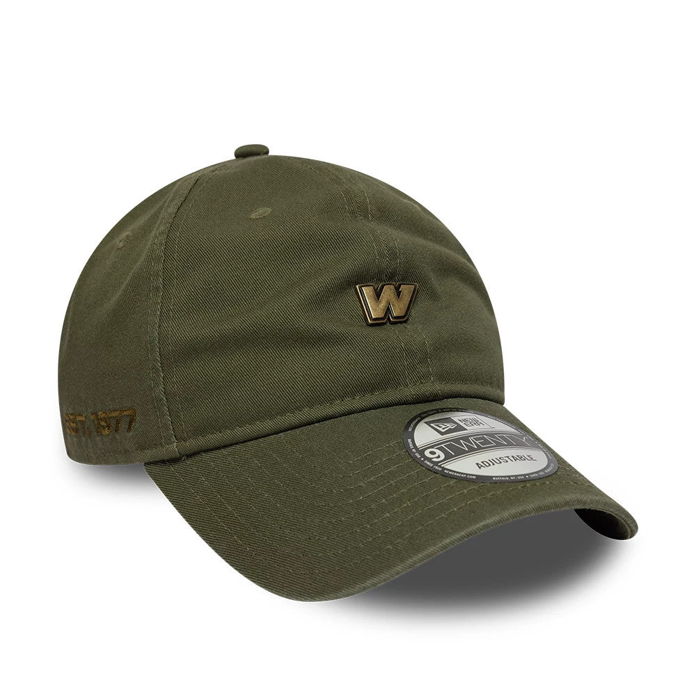 Williams Washed Green New Era 9TWENTY Adjustable Cap, three-quarter view showing a gold embroidered W on the front panel, a matching EST. 1920 on the side, and a 9TWENTY size sticker on the curved visor.
