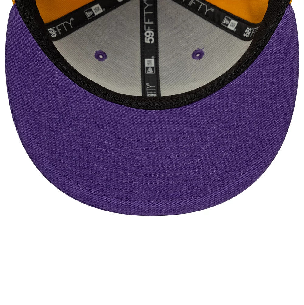 LA Lakers NBA Hardwood Classic Players Purple New Era 59FIFTY Fitted Cap, inside view showing the black taping with New Era branding, purple eyelets, an orange sweatband, and a vivid purple undervisor complementing the structured design.