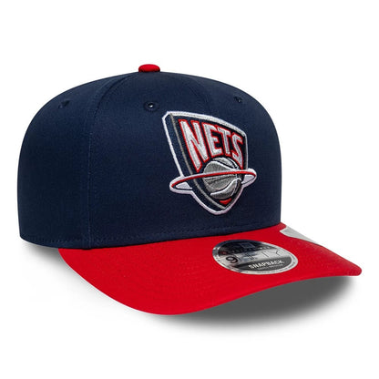 Pictured is this NBA Hardwood Classic New Jersey Nets 9FIFTY Snapback cap in dark blue. 3